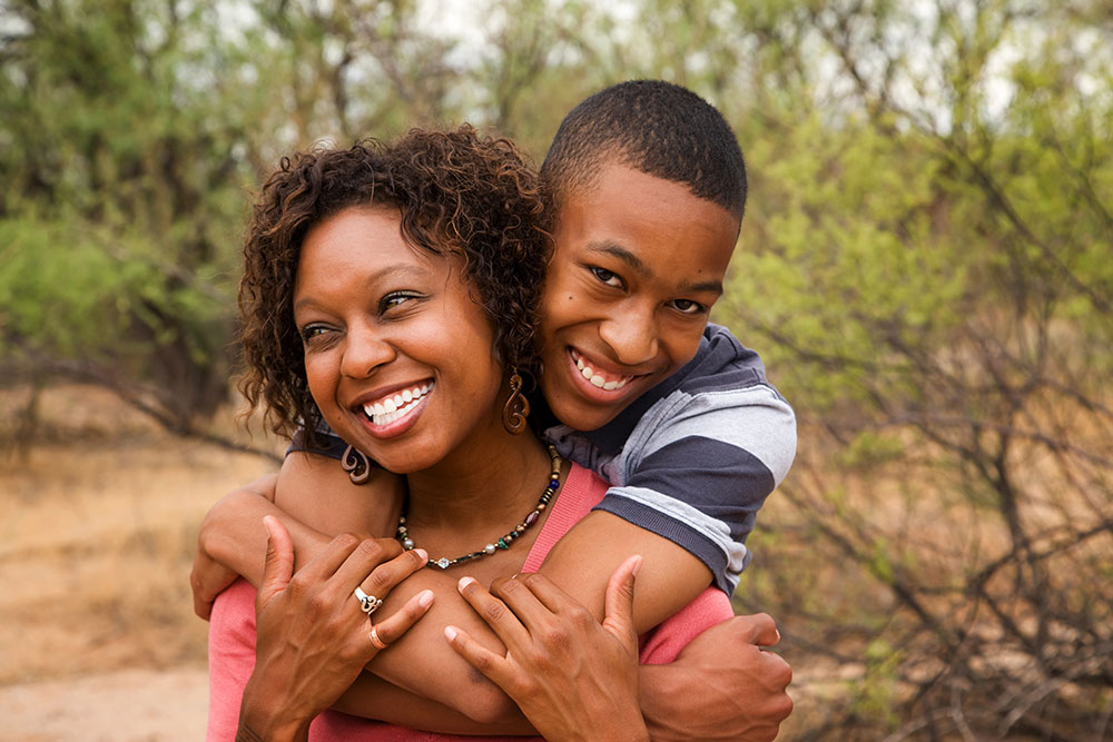 Mom and son hugging